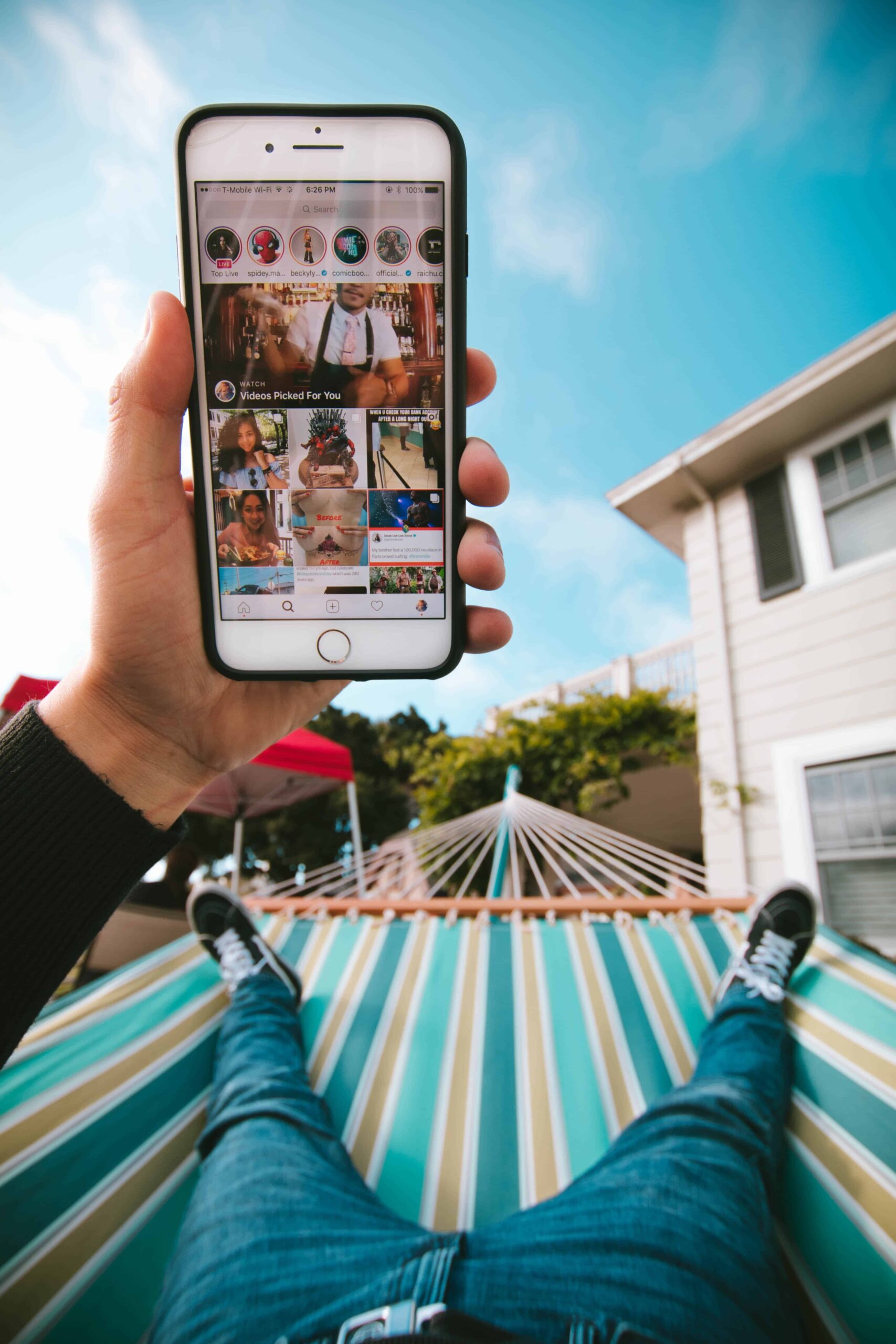 man looking at instagram while laying down